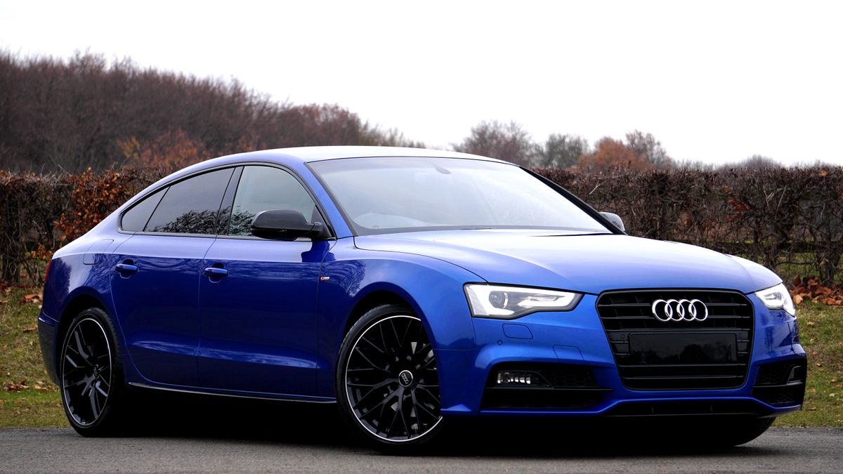 A blue Audi A5 Sportback with a clean Singleframe grille and glossy paint.