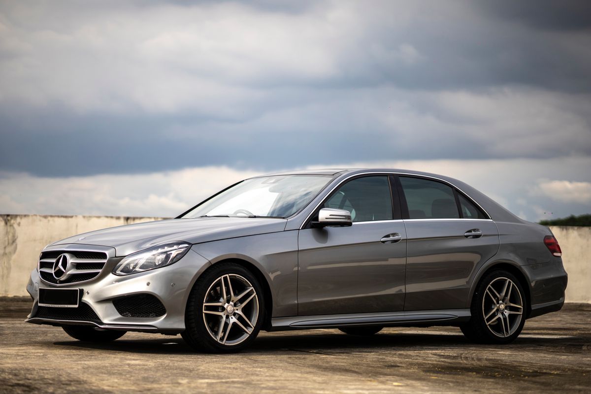 A silver Mercedes-Benz E-Class sedan with clean paint and a polished grille star.